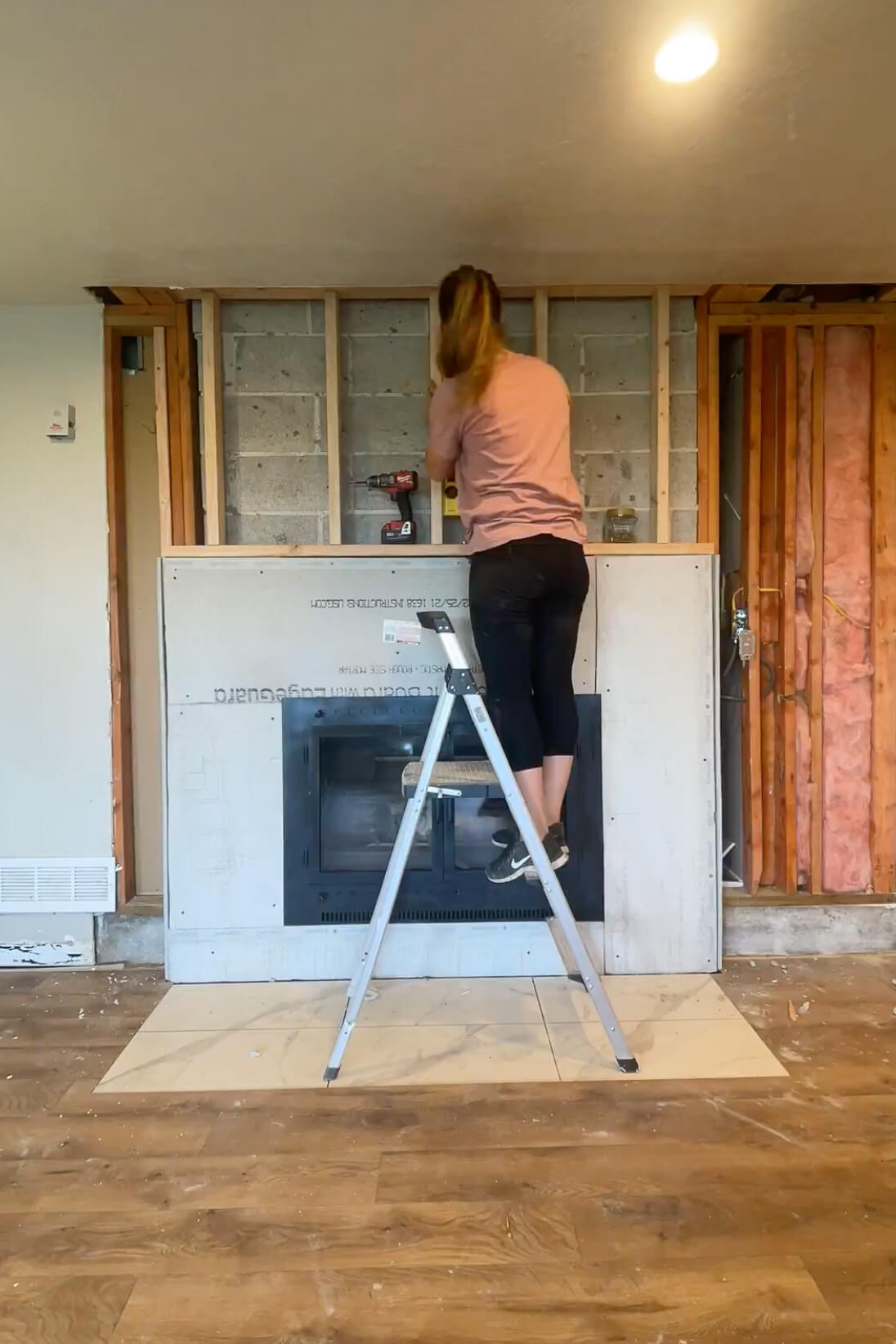 Framing in the top of my fireplace to get ready for drywall. 